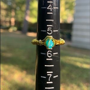 Two rings. One teal and one purple